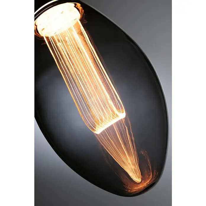 Paulmann Inner Glow LED-Lampe Vintage Glühlampenform E27 - E27, Nicht Dimmbar, Gelb, 80 lm, 3,5 W, Kerze, Farbe: Smoky - Nahaufnahme einer grauen Retro-Glühbirne mit einem warmen, orangefarbenen Filament, das ein sanftes Licht ausstrahlt.