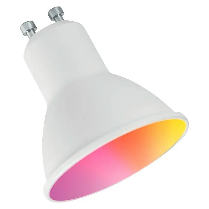 Muvit iO Bombilla LED inteligente RGB y blancos - RGB, 400 lm, 5 W, 1 ud. - La imagen muestra una bombilla inteligente GU10 con iluminación de colores y una carcasa blanca sobre un fondo negro.