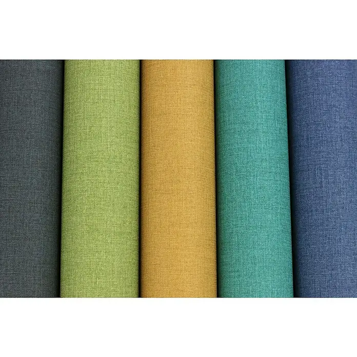 Rasch Florentine III Vliestapete - Dunkelblau, Uni, 10,05 x 0,53 m - Farbige Textilrollen liegen nebeneinander und zeigen die feine Textur des Stoffes, ideal für Textildesigner und Innenausstatter.