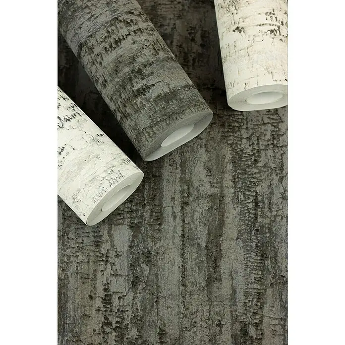 Rasch Composition Vliestapete Birke - Grauweiß, Floral, 10,05 x 0,53 m - Nahaufnahme von Tapetenrollen mit einem abstrakten Muster in Grau- und Weißtönen, die eine moderne und stilvolle Wandgestaltung ermöglichen.