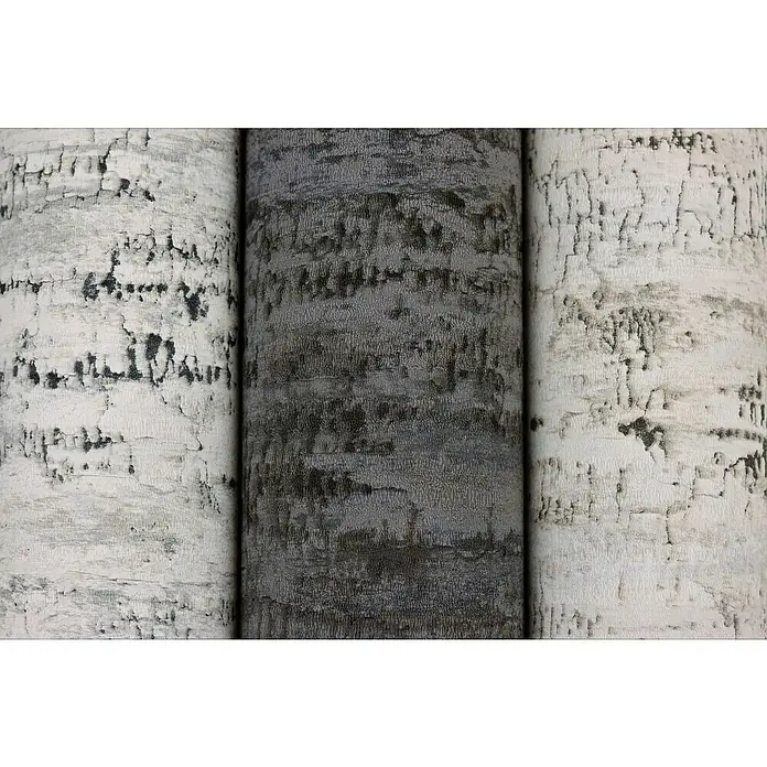 Rasch Composition Vliestapete Birke - Anthrazit, Floral, 10,05 x 0,53 m - Nahaufnahme von drei strukturierten, zylindrischen Säulen mit unterschiedlichen Graustufen, die eine taktile und grafische Oberfläche zeigen.