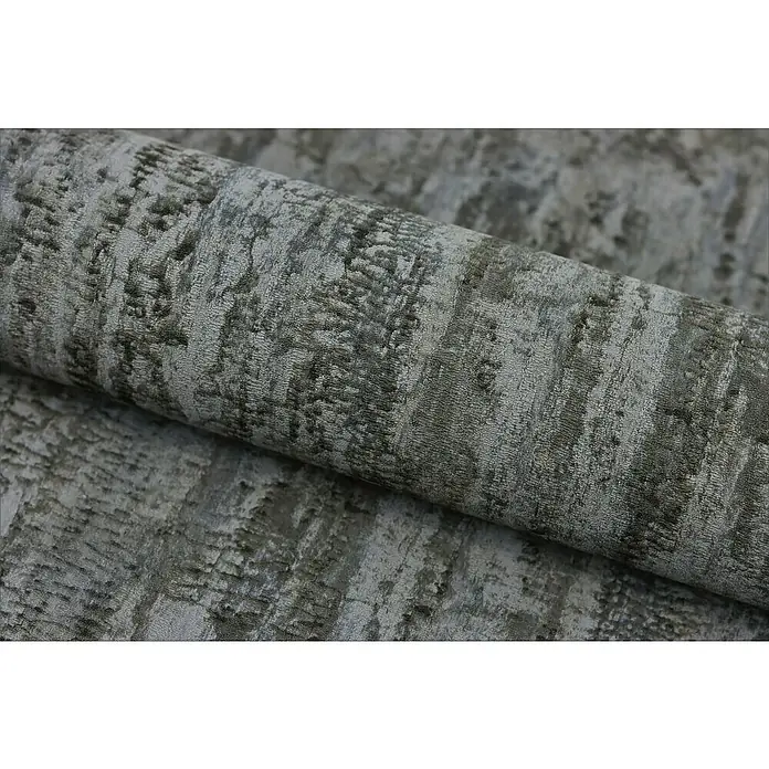 Rasch Composition Vliestapete Birke - Anthrazit, Floral, 10,05 x 0,53 m - Nahaufnahme eines gerollten Stoffes mit einem einzigartigen grauen und schwarzen Muster, ideal für Polster- und Dekorationsprojekte.