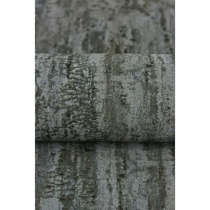 Rasch Composition Vliestapete Birke - Anthrazit, Floral, 10,05 x 0,53 m - Detailaufnahme eines gerollten Stoffes mit einem grauen, abstrakten Muster. Ideal für Möbelbezüge oder Dekorationen mit modernem Touch.