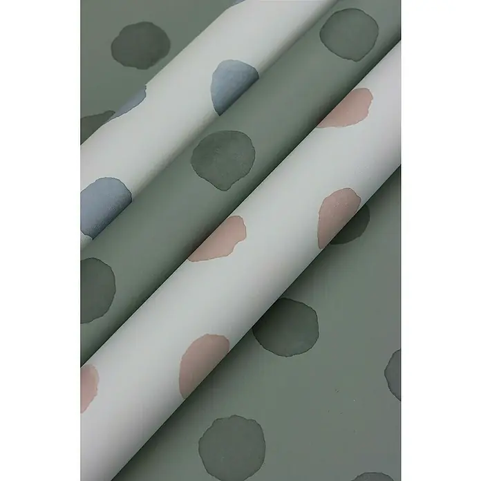 Rasch Bambino XIX Vliestapete Punkte - Blau, Grafisch, 10,05 x 0,53 m - Eine Nahaufnahme von drei Rollen Tapeten mit einem Tupfenmuster in verschiedenen Farben, ideal für ein stilvolles Interieur.
