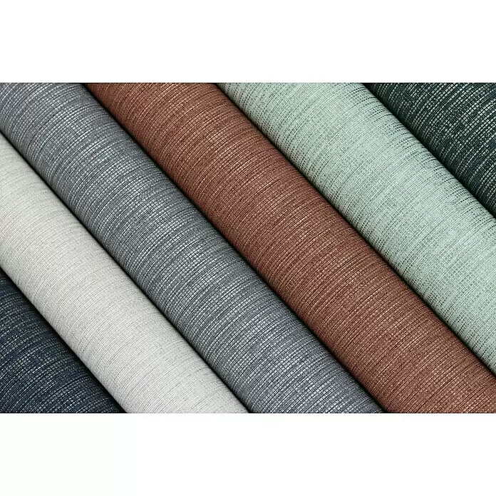 Rasch Florentine III Vliestapete Textile Stoffoptik - Greige, Uni, 10,05 x 0,53 m - Nahaufnahme mehrerer Rollen strukturierter Stoffe oder Tapeten in einer Farbpalette von Blau, Grau, Braun und Grün.