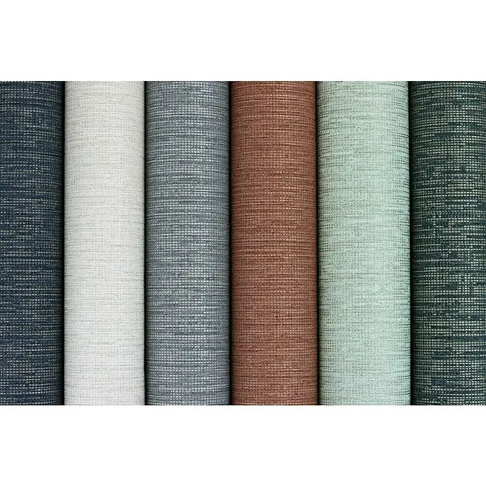 Rasch Florentine III Vliestapete Textile Stoffoptik - Dunkelgrau, Uni, 10,05 x 0,53 m - Eine Nahaufnahme von Rollen verschiedenfarbiger Textiltapeten mit feinen Webmustern, ideal für stilvolle Wandgestaltungen.