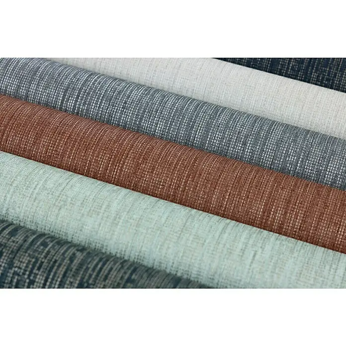Rasch Florentine III Vliestapete Textile Stoffoptik - Dunkelgrau, Uni, 10,05 x 0,53 m - Nahaufnahme von farbigen Tapetenrollen mit Texturmuster, perfekt für die Wandgestaltung im Innenbereich.