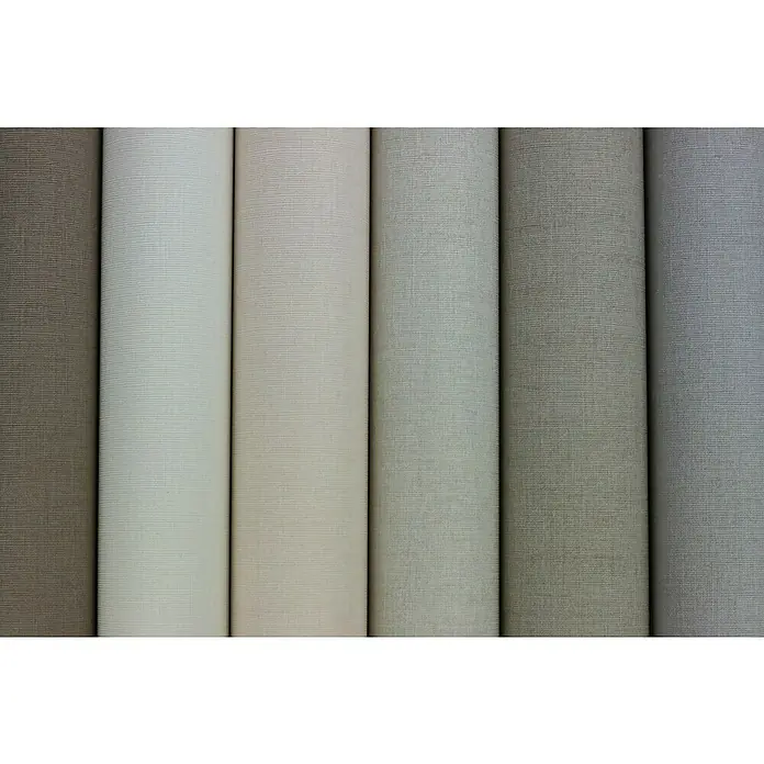 Rasch Florentine III Vliestapete - Weiß, Uni, 10,05 x 0,53 m - Nahaufnahme von Tapetenrollen in verschiedenen Grautönen, die Texturen und Farbnuancen des Produkts hervorheben.