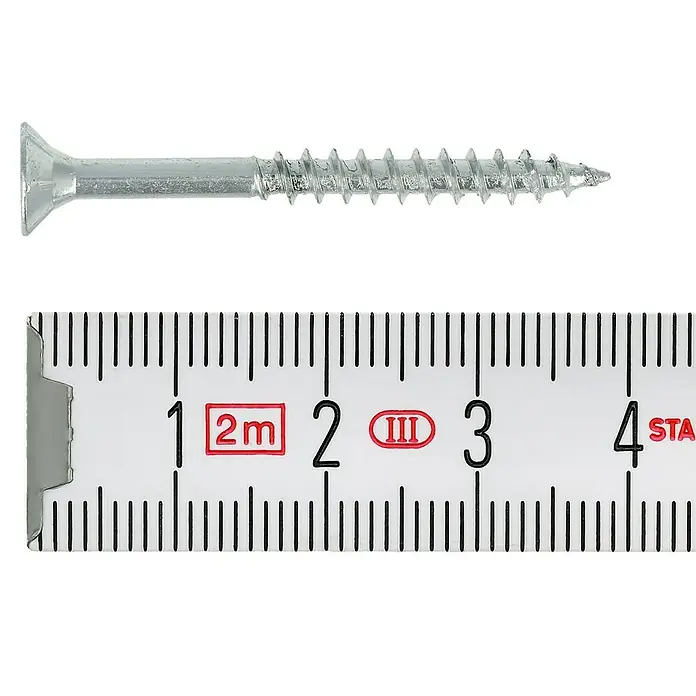 Profi Depot Spanplattenschraube VZ - Ø x L: 4 x 40 mm, 1.000 Stk., Verzinkt - Silberne Holzschraube mit Senkkopf liegt neben einem Messstab, der Längenangaben bis 4 cm anzeigt.