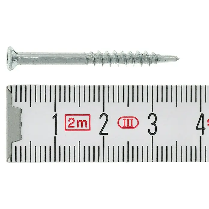 Profi Depot Dielenschraube VZ TX - Durchmesser: 3,2 mm, Länge: 35 mm, TX für TORX-Antriebe, 200 Stk. - Nahaufnahme einer Schraube mit metrischem Lineal zur Größenbestimmung.