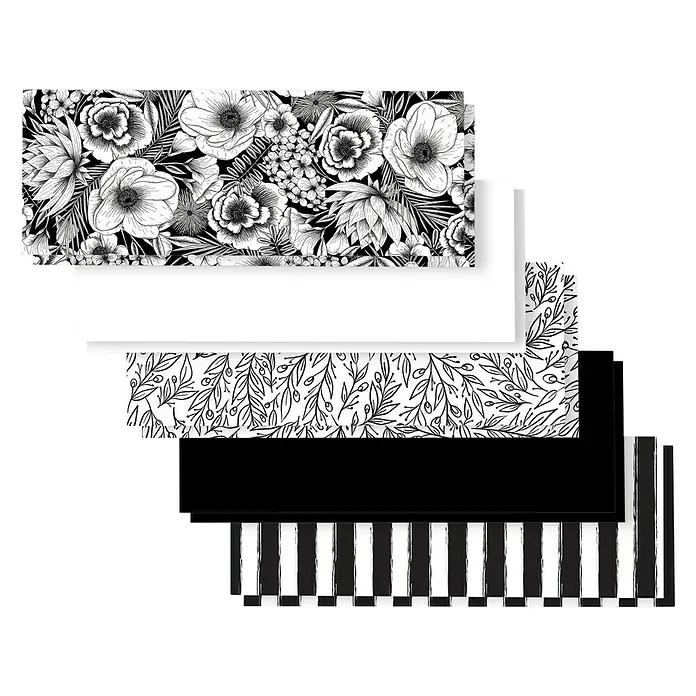 Cricut Joy Papier Deluxe Paper - 10 Stk., Schwaz/Weiß Botanicals, 30 x 11,5 cm, Cricut Schneideplotter - Eine Auswahl an Geschenkpapier mit verschiedenen Designs, darunter Blumenmuster, Blätter, einfarbig schwarz und Streifen.