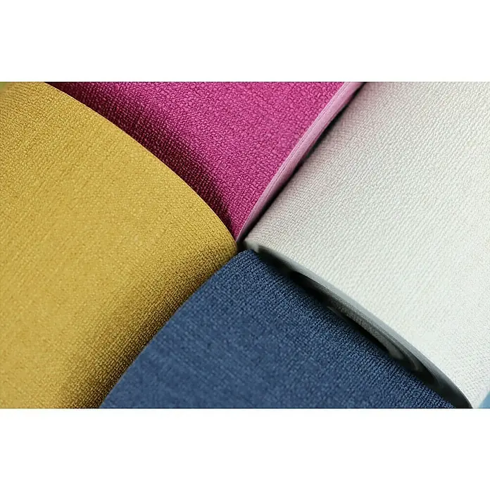 Rasch Salsa Vliestapete - Dunkelblau, Uni, 10,05 x 0,53 m - Nahaufnahme von bunten gerollten Textiltapeten in Gelb, Pink, Weiß und Blau mit leichter Textur.