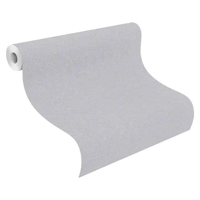 Rasch Bambino XIX Vliestapete - Blaugrau, Uni, 10,05 x 0,53 m - Eine Rolle grauer Tapete, die sanft abgerollt ist und die feine Textur des Materials zeigt, ideal für moderne Innenräume.