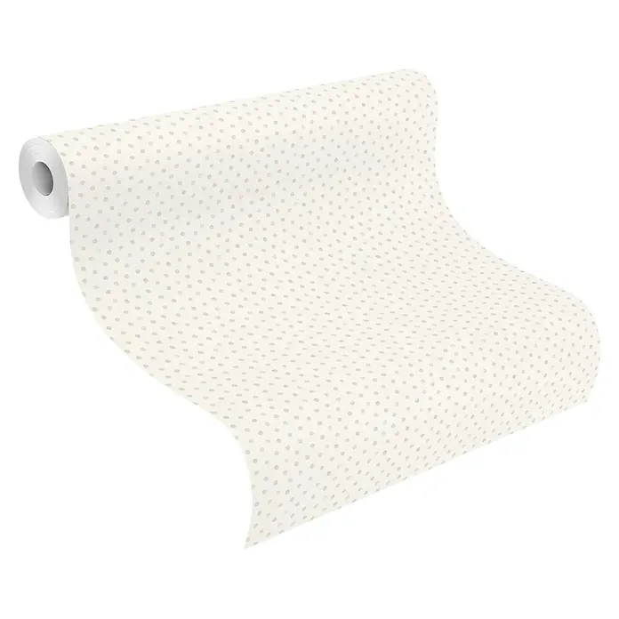 Rasch Bambino XIX Vliestapete Pünktchen - Weiß-Grau, Grafisch, 10,05 x 0,53 m - Nahaufnahme einer Rolle beiger Tapete mit kleinen grauen Punkten. Perfekt für die Dekoration von Wohnräumen mit subtilem Muster.