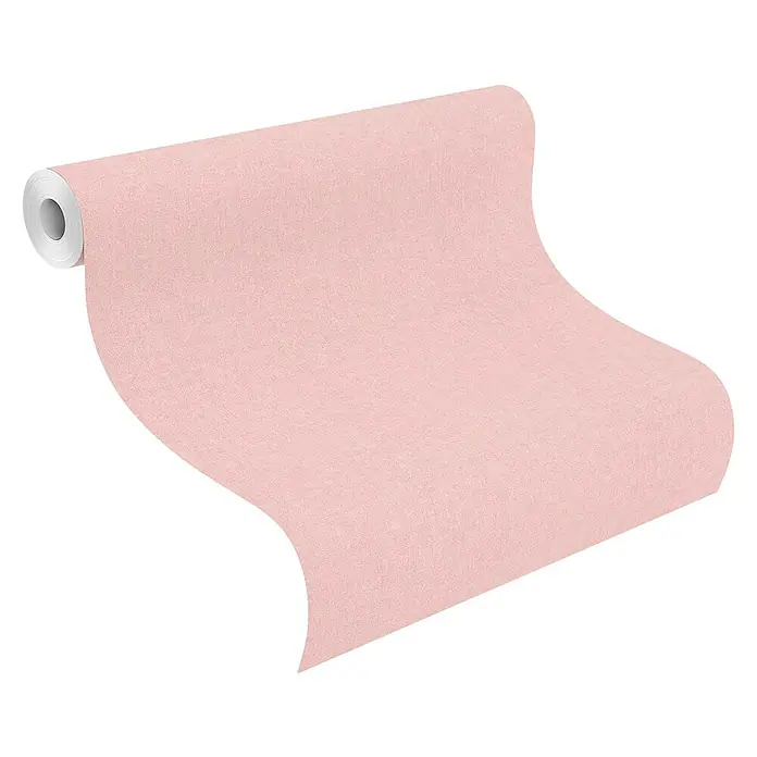 Rasch Bambino XIX Vliestapete - Rosa, Uni, 10,05 x 0,53 m - Nahaufnahme einer Rolle zartrosa strukturierter Tapete, die sich von einer Spule abwickelt. Die Tapete bietet eine subtile, elegante Textur.