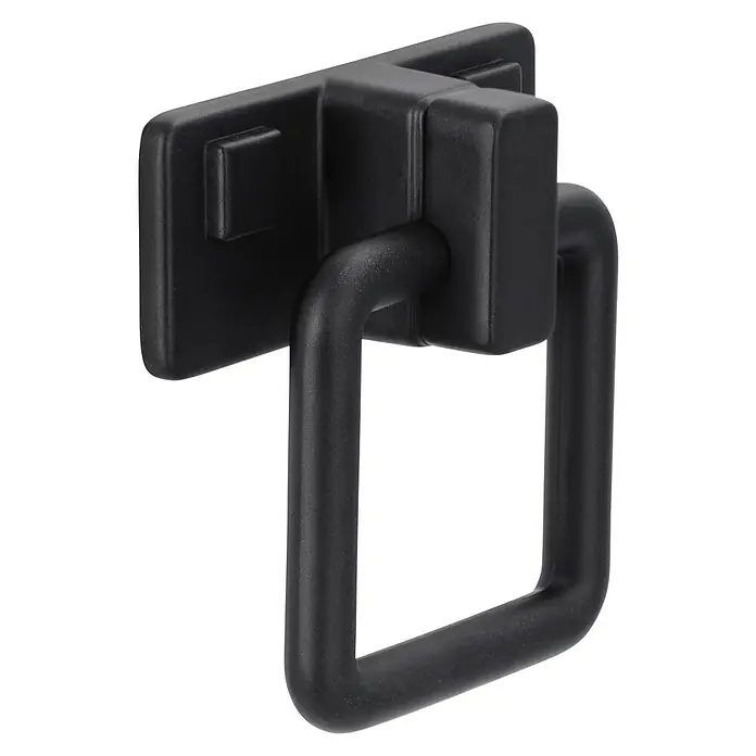 Siro Türklopfer - L x B x H: 51 x 50 x 20 mm, Stahl - Nahaufnahme eines schwarzen, quadratischen Schubladengriffs aus Metall, der ein elegantes und modernes Design aufweist.