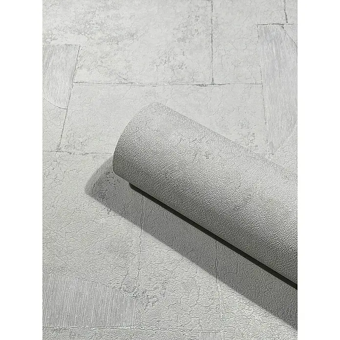 Marburg Papis Loveday Vliestapete I - Hellgrau, Grafisch, 10,05 x 0,7 m - Nahaufnahme einer Rolle grauer Strukturtapete, die die Textur und das Design des Produkts hervorhebt.