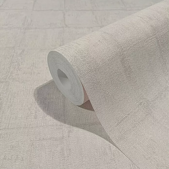 Marburg Botanica Vliestapete - Rosa/Grau, Fliesenoptik, 10,05 x 0,53 m - Hellbeige strukturierte Tapetenrolle mit gewebtem Muster, teilweise abgerollt zur Präsentation des Designs.