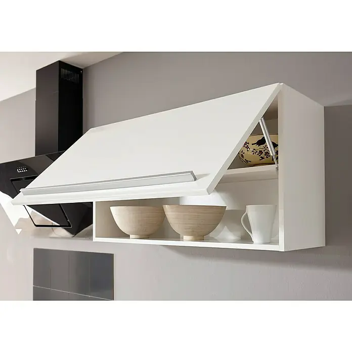 Respekta Premium Composición de cocina Gabriel - Ancho: 290 cm, Blanco, Con electrodomésticos - La imagen muestra un armario alto de cocina blanco con un compartimento abatible abierto, con cuencos y una taza en el interior. Al lado hay una campana extractora.
