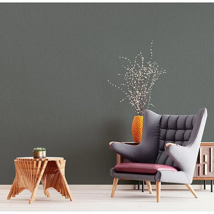 Marburg Kids' Walls Vliestapete - Schwarz, Uni, 10,05 x 0,53 m - Stilvoller Ohrensessel in Grau mit auffälligem Sitzkissen und passendem Beistelltisch. Perfekt für ein modernes Wohnambiente.