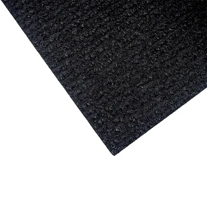 Moqueta a metros Rizada - Ancho: 200 cm, 100% Poliéter sulfona, Negro - Primer plano de un trozo de alfombra negra que muestra la textura y el material del producto.