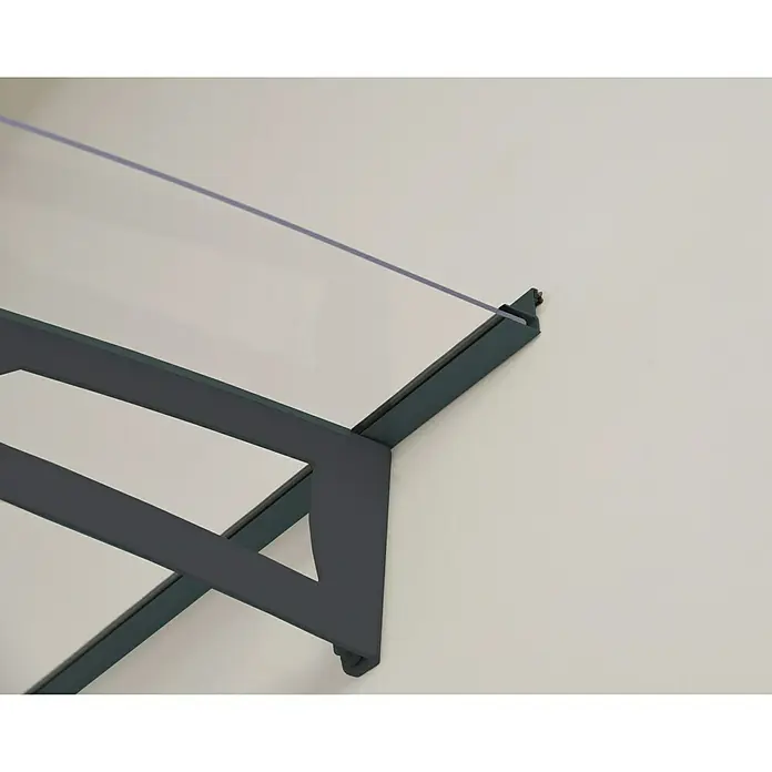 Palram – Canopia Pultvordach Aquila - 205,5 x 91,5 x 17,5 cm, Anthrazitgrau, Farbe Dach: Klar - Nahaufnahme einer modernen, grauen Haustürüberdachung mit klarem Glas, die an einer weißen Wand befestigt ist.