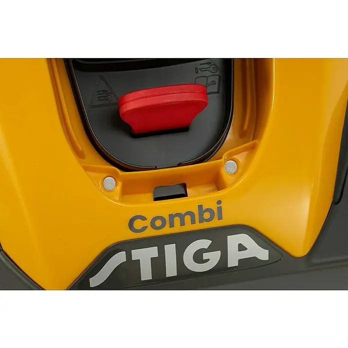 Stiga Akku-Rasenmäher COMBI 336e - 48 V, 1 Akku, 2 Ah, Schnittbreite: 34 cm - Nahaufnahme eines gelben Stiga Combi Rasenmähers, der ein robustes und effizientes Design für die Rasenpflege zeigt.