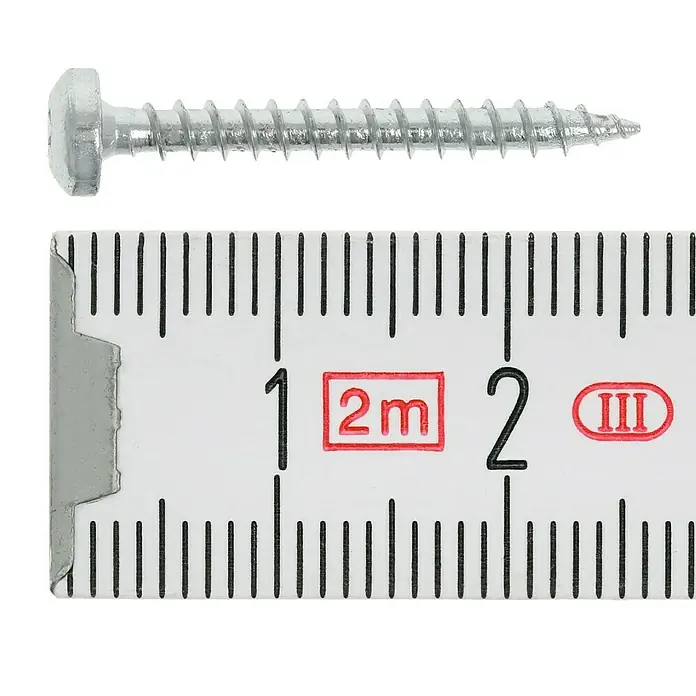 Profi Depot Spanplattenschraube VZ - 3 x 25 mm, 200 Stk., Verzinkt, TX für TORX-Antriebe - Eine Schraube wird mit einem Messschieber auf ihre Länge gemessen, um ihre Größe zu bestimmen.