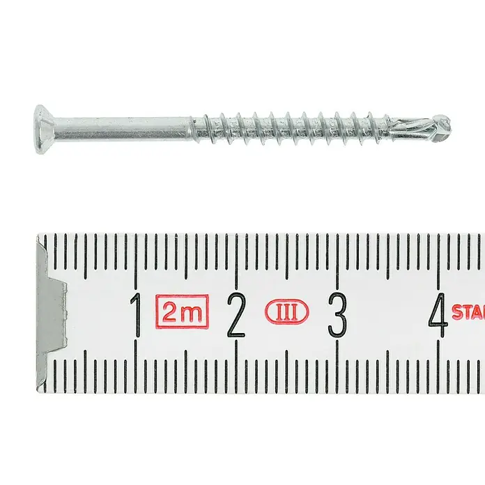 Profi Depot Dielenschraube VZ TX - Durchmesser: 3,2 mm, Länge: 40 mm, TX für TORX-Antriebe, 200 Stk. - Eine Nahaufnahme einer Schraube, die neben einem Messlineal liegt, um ihre Länge zu zeigen.
