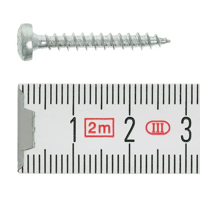 Profi Depot Spanplattenschraube VZ - 3,5 x 25 mm, 200 Stk., Verzinkt, TX für TORX-Antriebe - Nahaufnahme einer Senkkopfschraube neben einem Messlineal. Die Schraube ist silbern und hat ein metrisches Gewinde.