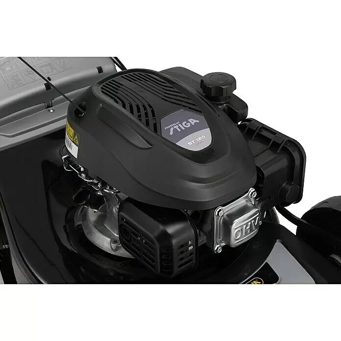 Stiga Benzin-Rasenmäher AL4 46 A - 1,9 kW, 123 cm³, Schnittbreite: 46 cm - Nahaufnahme eines schwarz-silbernen Rasenmähermotors mit „STIGA ST 120 OHV“-Beschriftung auf der Motorabdeckung.