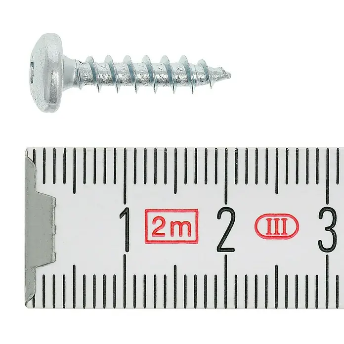 Profi Depot Spanplattenschraube VZ - 4 x 17 mm, 200 Stk., Verzinkt, TX für TORX-Antriebe - Ein silberfarbener Senkkopfschraube wird mit einem Messlineal mit Zentimetereinteilung verglichen.