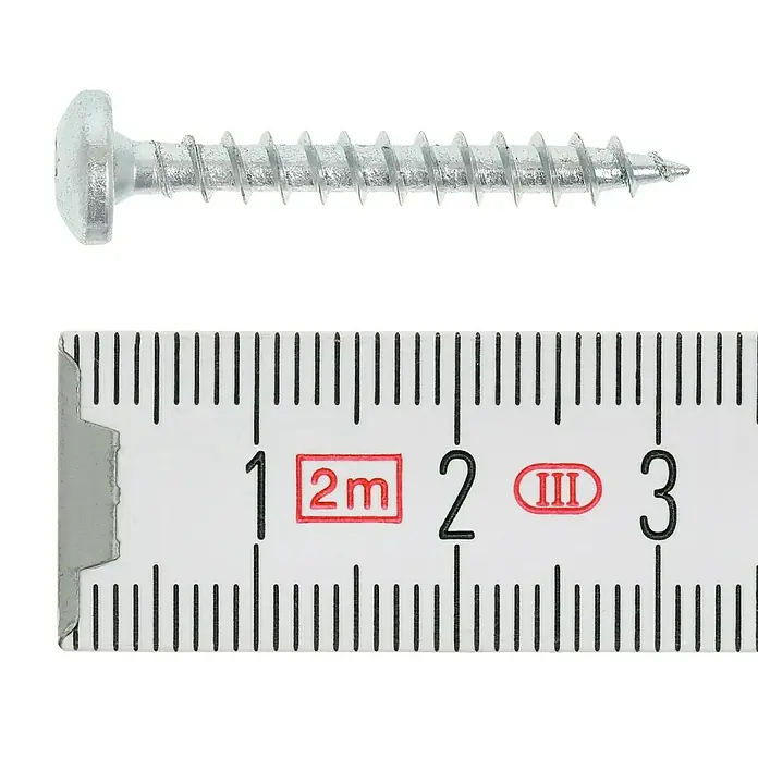 Profi Depot Spanplattenschraube VZ - 4 x 30 mm, 200 Stk., Verzinkt, TX für TORX-Antriebe - Detailansicht einer Senkkopfschraube neben einem Messlineal zur Größenbestimmung. Ideal für Bau- und Reparaturprojekte.