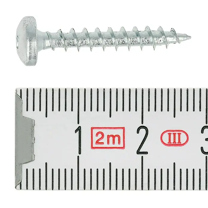 Profi Depot Spanplattenschraube VZ - 4 x 25 mm, 200 Stk., Verzinkt, TX für TORX-Antriebe - Nahaufnahme einer Senkkopfschraube mit Kreuzschlitz und einer Messskala zur Bestimmung der Länge des Produkts.