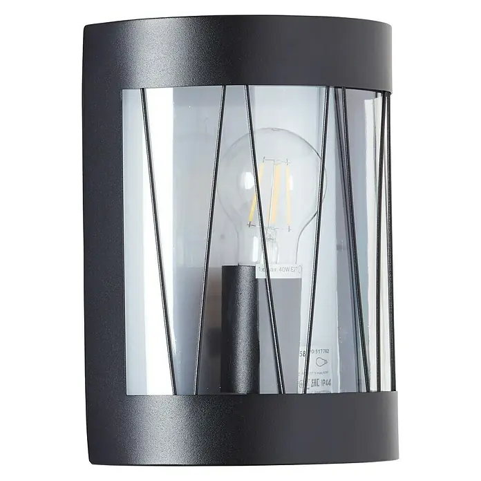 Brilliant Reed Außenwandleuchte - 40 W, 10,5 x 18,2 x 23,6 cm, Schwarz matt, IP44 - Nahaufnahme einer schwarzen, zylindrischen Wandleuchte mit Glaseinsatz und dekorativen Metallstreben, die eine Glühbirne zeigt.