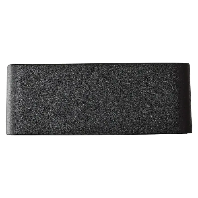 Brilliant LED-Außenwandleuchte Golda - 7 W, 14,5 x 12 x 4,5 cm, Schwarz, IP54 - Nahaufnahme eines mattschwarzen, rechteckigen Gehäuses, das Textur und minimalistisches Design betont. Ideal für moderne Technologie.