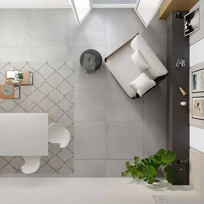 Feinsteinzeugfliese Homestone Grey - 100 x 100 cm, Grau, Matt - Draufsicht auf ein modernes offenes Wohnzimmer mit Sofa, Esstisch, Teppich und Pflanzen auf grauen Fliesen.