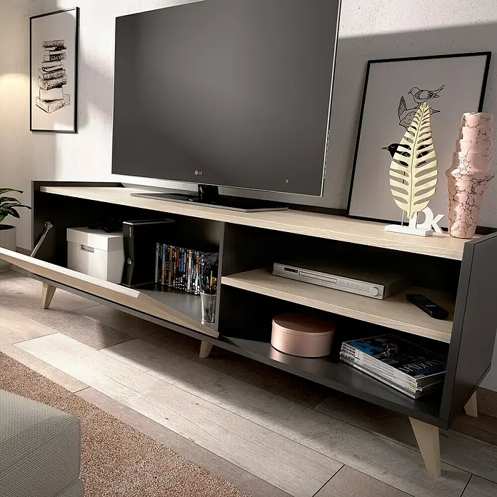 Dekit Mueble para TV Ness - L x An x Al: 43 x 155 x 47 cm, Natural/Grafito - Primer plano de un mueble bajo moderno gris y marrón claro con una puerta abierta y varios objetos dentro y encima.
