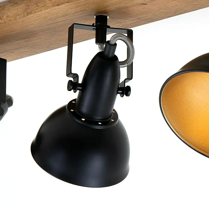 Briloner Barnim Regleta - 75 W, L x An x Al: 50 x 11 x 15,7 cm, Negro/Marrón, Negro/Dorado, E14, 3 ud. - Primer plano de un foco negro sobre una viga de madera, que muestra un diseño moderno e industrial.