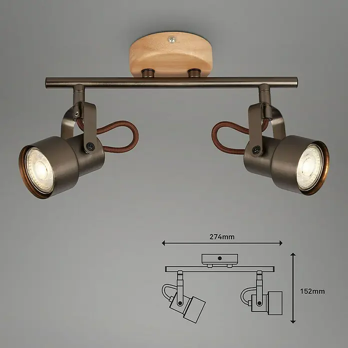 Briloner Tahun Regleta - 10 W, L x An x Al: 27,4 x 9 x 15,2 cm, Gris/Marrón, GU10, 2 ud. - Primer plano de una lámpara de techo moderna con dos focos, detalles de madera y toques de latón, que emite un brillo cálido.