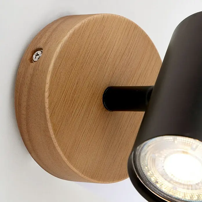 Briloner Muritz Aplique de pared redondo - 35 W, Ø x Al: 9 x 12 cm, Negro/Marrón, GU10 - Primer plano de una lámpara de pared con base de madera y cabezal negro.