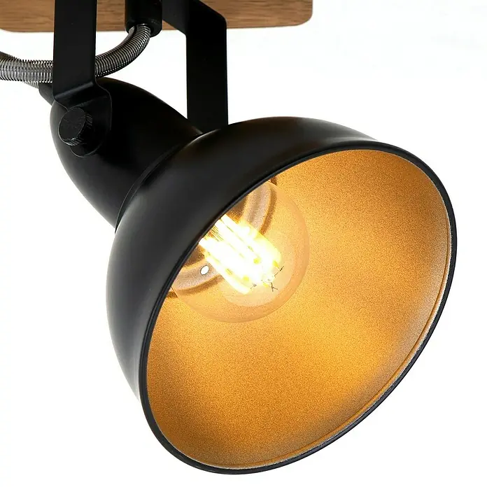 Briloner Barnim Aplique de pared redondo - 25 W, Ø x Al: 11 x 15,5 cm, Negro/Marrón, Negro/Dorado, E14 - Primer plano de un foco de techo negro con interior dorado y luz blanca cálida, creando un ambiente acogedor.