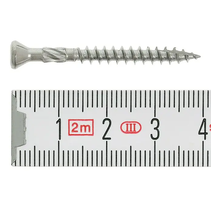 Profi Depot H-Paneelschrauben Turbo Drill - Durchmesser: 4 mm, Länge: 40 mm, Edelstahl, TX für TORX-Antriebe, Senkkopf, 200 Stk. - Nahaufnahme einer Schraube, gemessen mit einem Zollstock. Die Schraube ist silbern und hat ein Gewinde.