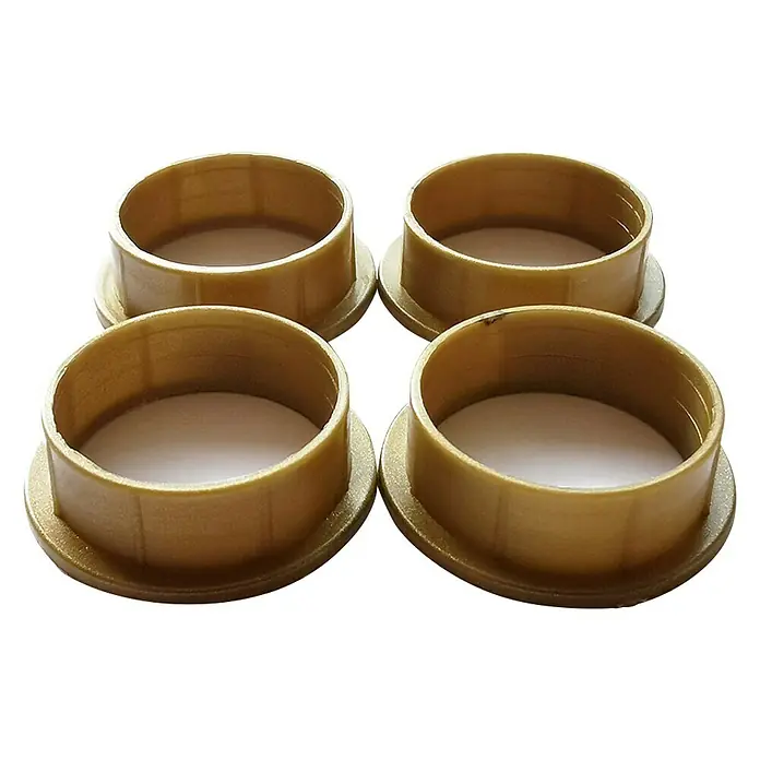 Lienbacher Drücker Lager-Set - Durchmesser: 20/18 mm, Kunststoff, Braun, 4 Stk. - Vier goldene, runde Dichtungsmanschetten mit breitem Rand auf schwarzem Hintergrund. Ideal für Rohrverbindungen.