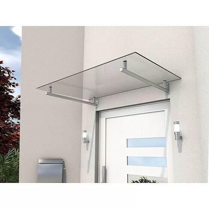 Gutta Vordach HD - 160 x 100 x 19,5 cm, Edelstahl - Klares Glasvordach mit Edelstahlstützen über einer weißen Haustür an einer hellen Gebäudewand montiert.