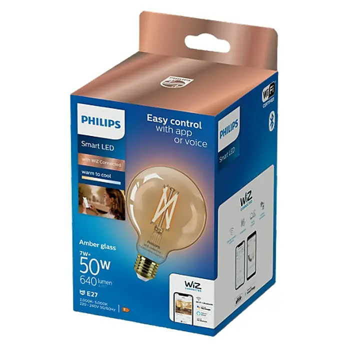 Philips Wiz Smart-LED-Lampe - E27, Dimmbar, Mehrfarbig, 640 lm, 7 W - Eine Verpackung für eine Philips Smart LED-Lampe mit bernsteinfarbenem Glas, die über App oder Sprache steuerbar ist und warmes bis kühles Licht bietet.