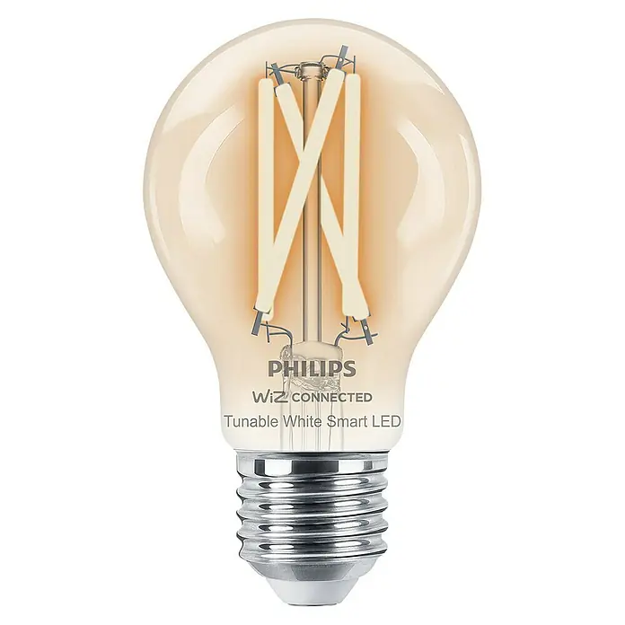 Philips Wiz Smart-LED-Lampe - E27, Dimmbar, Mehrfarbig, 806 lm, 6,7 W, Farbe: Durchsichtig - Nahaufnahme einer Philips Wiz Connected dimmbaren LED-Glühbirne mit weißer Farbtemperatur auf schwarzem Hintergrund.