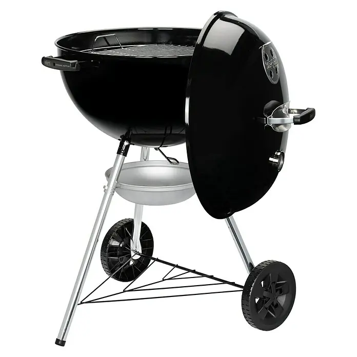 Weber Kugelgrill Original Kettle E-5710 - Durchmesser Grillfläche: 54 cm, Schwarz/Silber - Ein Weber Holzkohlegrill, Original Kettle, in Schwarz mit silberfarbenen Beinen und Ablage, ideal für Grillabende im Freien.
