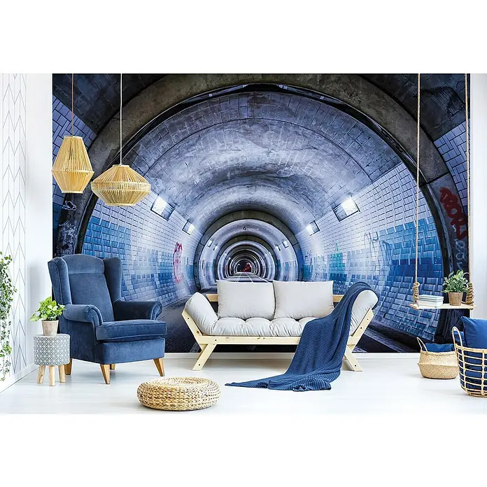 Fototapete Tunnel IIIB x H: 254 x 184 cm, Vlies - Wohnzimmer mit blauem Sessel, Futonbett, Beistelltisch und Pendelleuchten. Das Tunnel-Wandbild verleiht dem Raum eine besondere Atmosphäre.