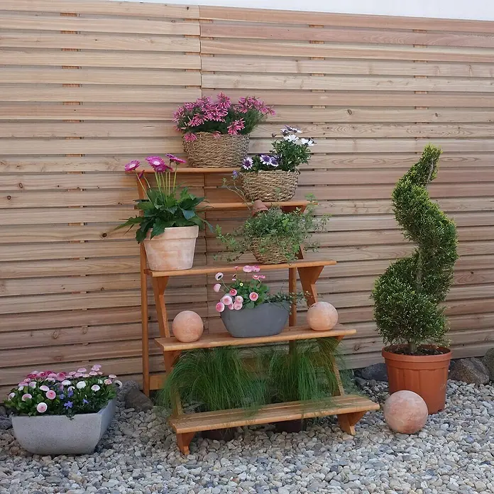 Promadino Blumentreppe - 100 x 78 x 109 cm, Kiefer, Braun - Ein dekoratives Holzregal mit bunten Blumentöpfen und einer spiralförmigen Pflanze, ideal für Garten oder Terrasse.